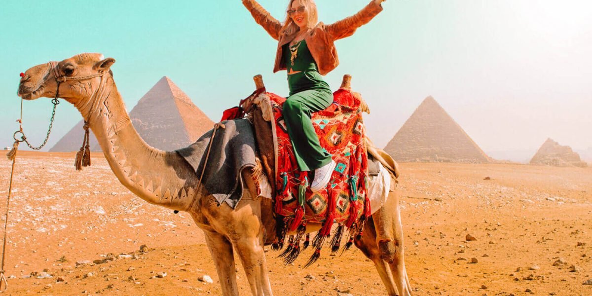 a-wonderful-shot-of-a-girl-on-the-camel-in-front-of-the-pyramids
